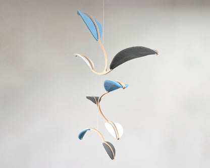 Leaf Mobile 

Felt & Wood Leaf Mobile, Adult or Baby Mobile Gift Idea, Plant inspired Sculpture, Kinetic Art Mobile. Pale Blue, White and Grey

This vibrant felt leaf mobile is a charming addition to your home decor, offering a lightweight and artistic touch. Handmade with colorful felt leaf shapes, it features independently rotating wooden stems crafted from birch wood, arranged in a customizable color order that can be adjusted anytime.