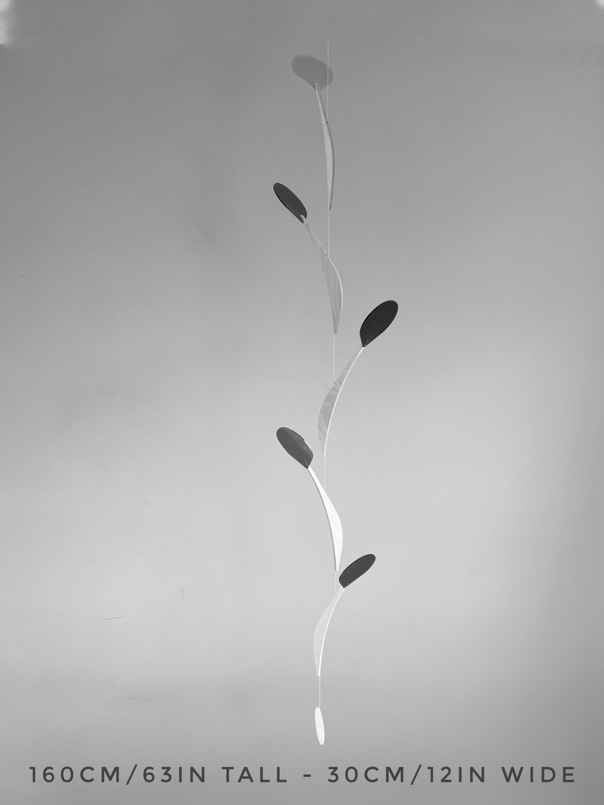 Modern Kinetic Mobile Art - Wall Hanging Relaxing Decor for Scandinavian Home Design, Office Spaces, Waiting Rooms & Minimalist Yoga Studio

Introducing Vine, a kinetic mobile inspired by the graceful climb of vines. This sleek, tall & slender mobile brings movement and calm to any space, whether it's a mid-century modern living room, a yoga studio or an office. 