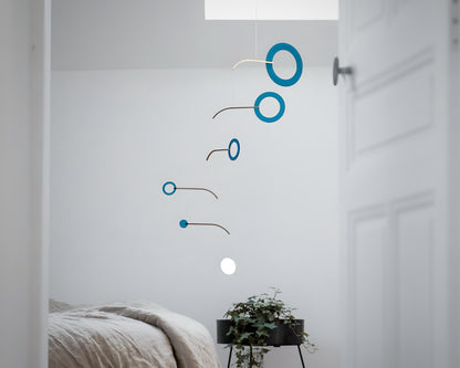 Teal Kinetic Hanging Mobile Sculpture, Minimalistic Circles Adult Mobile Home Decor - Halo Halo Handcrafted By The Illuminist

Introducing Halo Halo Mobile - A stunning piece of kinetic art that will bring movement and interest to any room.