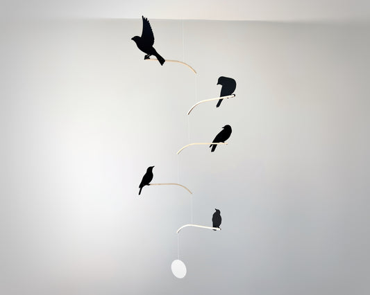 Nosey Bird Kinetic Mobile Sculpture, Adult & Baby Mobile. Hanging Silhouette Wall Art, Counterbalanced Handcrafted Acrylic & Wood Bird Mobile

Introducing ‘Nosey Birds’ - A fun piece of kinetic art that will bring movement and interest to any room. Handcrafted from responsibly sourced engineered birch, this unique mobile features 5 laser cut bird silhouettes of increasing size in a stunning frosted black acrylic. Composed so the birds are looking towards each other while perched on the curved birch arm.