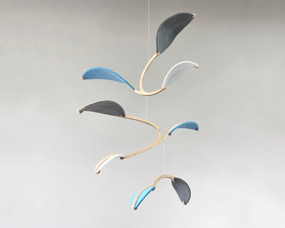 Leaf Mobile 

Felt & Wood Leaf Mobile, Adult or Baby Mobile Gift Idea, Plant inspired Sculpture, Kinetic Art Mobile. Pale Blue, White and Grey

This vibrant felt leaf mobile is a charming addition to your home decor, offering a lightweight and artistic touch. Handmade with colorful felt leaf shapes, it features independently rotating wooden stems crafted from birch wood, arranged in a customizable color order that can be adjusted anytime.